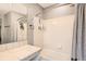 Bright bathroom with white tiled shower and tub, complemented by modern fixtures and a neutral color scheme at 1539 Bennet Mountain Rd, Castle Rock, CO 80109