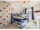 Fun bedroom with bunk beds, climbing wall, and mountain mural, perfect for adventure and play at 1539 Bennet Mountain Rd, Castle Rock, CO 80109