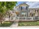 Charming townhome with a fenced front yard, well-manicured lawn, and inviting entrance at 1539 Bennet Mountain Rd, Castle Rock, CO 80109