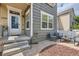 Inviting front porch with stylish seating area, perfect for relaxing and enjoying the outdoors at 1539 Bennet Mountain Rd, Castle Rock, CO 80109