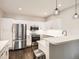 Modern kitchen featuring stainless steel appliances, white cabinets, and sleek countertops at 1539 Bennet Mountain Rd, Castle Rock, CO 80109