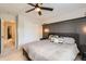 Comfortable main bedroom featuring a ceiling fan, plush bedding, and ample closet space at 1539 Bennet Mountain Rd, Castle Rock, CO 80109