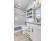 Updated bathroom with shower/tub combination, modern vanity, and neutral color palette at 2108 Alcott Way, Broomfield, CO 80023
