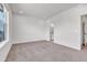 Bright bedroom boasts neutral walls and carpet with a door leading to an en suite bathroom at 2108 Alcott Way, Broomfield, CO 80023