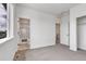 Neutral bedroom featuring plush carpet with an open bathroom and walk-in closet visible at 2108 Alcott Way, Broomfield, CO 80023