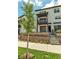 Three-story townhouse featuring a balcony, garage, and tiered landscaping in a residential area at 2108 Alcott Way, Broomfield, CO 80023