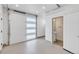 Bright, clean garage with a modern glass door, utility sink, and access to a half bathroom at 2108 Alcott Way, Broomfield, CO 80023