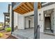 Modern townhome showing access to the garage with a bathroom on the main floor near stairway at 2108 Alcott Way, Broomfield, CO 80023
