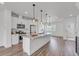 Bright, modern kitchen featuring stainless steel appliances, a spacious island, and stylish pendant lighting at 2108 Alcott Way, Broomfield, CO 80023