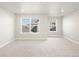 Bright bedroom with large windows and carpet flooring at 8115 Mt Harvard Rd, Littleton, CO 80125