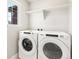 Laundry room with Whirlpool washer and dryer at 8115 Mt Harvard Rd, Littleton, CO 80125