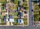 A high-angle view of the home surrounded by manicured yards and mature trees in a quiet neighborhood at 3011 Oneida St, Denver, CO 80207