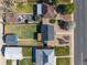 Bird's-eye view of the home and its fenced backyard surrounded by mature trees at 3011 Oneida St, Denver, CO 80207
