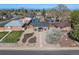 An aerial view shows this home with manicured yard and mature trees in a desirable neighborhood at 3011 Oneida St, Denver, CO 80207