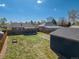 Aerial view of the backyard, including the patio, detached garage, and garden at 3011 Oneida St, Denver, CO 80207