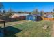Large backyard with grass, detached garage and garden at 3011 Oneida St, Denver, CO 80207