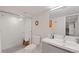 Modern bathroom features a glass-enclosed shower, sleek vanity, and stylish fixtures at 3011 Oneida St, Denver, CO 80207