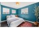 Charming bedroom featuring a queen-sized bed, hardwood floors, and two windows at 3011 Oneida St, Denver, CO 80207
