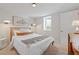 Inviting bedroom with stylish bedding and a bright window at 3011 Oneida St, Denver, CO 80207