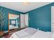 Spacious bedroom featuring hardwood floors and an entryway to an adjoining room at 3011 Oneida St, Denver, CO 80207