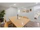 Dining room features a wooden table and modern chairs at 3011 Oneida St, Denver, CO 80207