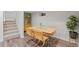 Dining area features a wooden table and modern chairs at 3011 Oneida St, Denver, CO 80207