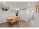 Dining area featuring a table and modern chairs at 3011 Oneida St, Denver, CO 80207