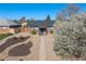 Charming single-story brick home with low maintenance landscaping and a beautiful flowering tree at 3011 Oneida St, Denver, CO 80207