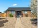 Charming brick home with a well-maintained front yard and inviting entrance at 3011 Oneida St, Denver, CO 80207