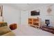Sitting area featuring a comfy velvet sofa and stylish decor at 3011 Oneida St, Denver, CO 80207