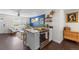 An open floor plan seamlessly connects the kitchen and living room, creating a modern and inviting space at 3011 Oneida St, Denver, CO 80207