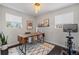 Bright office space with a stylish desk and an exercise bike at 3011 Oneida St, Denver, CO 80207