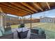 Cozy covered patio with outdoor seating and a view of the backyard at 3011 Oneida St, Denver, CO 80207