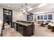 Basement bar with wine cooler and granite countertop at 6 Driver Ln, Littleton, CO 80123