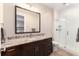 Basement bathroom with granite vanity and a walk-in shower at 6 Driver Ln, Littleton, CO 80123