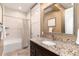 Basement bathroom with granite vanity and a shower/tub combo at 6 Driver Ln, Littleton, CO 80123