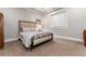 Basement bedroom with a comfortable bed and ample space at 6 Driver Ln, Littleton, CO 80123