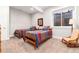 Cozy basement bedroom with two twin beds and a rocking chair at 6 Driver Ln, Littleton, CO 80123