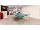 Basement game room featuring a ping pong table and dartboard at 6 Driver Ln, Littleton, CO 80123