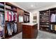 Large walk-in closet with ample shelving and hanging space at 6 Driver Ln, Littleton, CO 80123