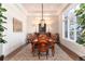 Bright dining room features a large table and hardwood floors at 6 Driver Ln, Littleton, CO 80123