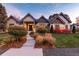 Inviting exterior of a beautifully designed home with landscaping at 6 Driver Ln, Littleton, CO 80123