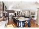 Gourmet kitchen with large island, stainless steel appliances, and granite counters at 6 Driver Ln, Littleton, CO 80123