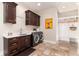 Functional laundry room with washer, dryer, and cabinets at 6 Driver Ln, Littleton, CO 80123