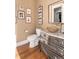 Powder room with unique vanity and glass sink at 6 Driver Ln, Littleton, CO 80123