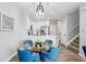 Stylish dining area with a glass table, modern lighting, and comfortable seating, perfect for entertaining guests at 5555 E Briarwood Ave # 2604, Centennial, CO 80122