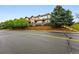 Street view of new townhomes with brick retaining wall and fresh landscaping at 5555 E Briarwood Ave # 2604, Centennial, CO 80122
