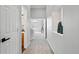 Bright hallway leading to a bedroom, showcasing neutral decor and an open layout, enhancing the home's flow at 5555 E Briarwood Ave # 2604, Centennial, CO 80122