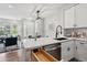 Open-concept kitchen with modern appliances, a breakfast bar, and seamless integration with the living area at 5555 E Briarwood Ave # 2604, Centennial, CO 80122