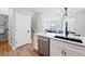 Well-designed kitchen with modern appliances and a layout that connects to the living room and stairway at 5555 E Briarwood Ave # 2604, Centennial, CO 80122